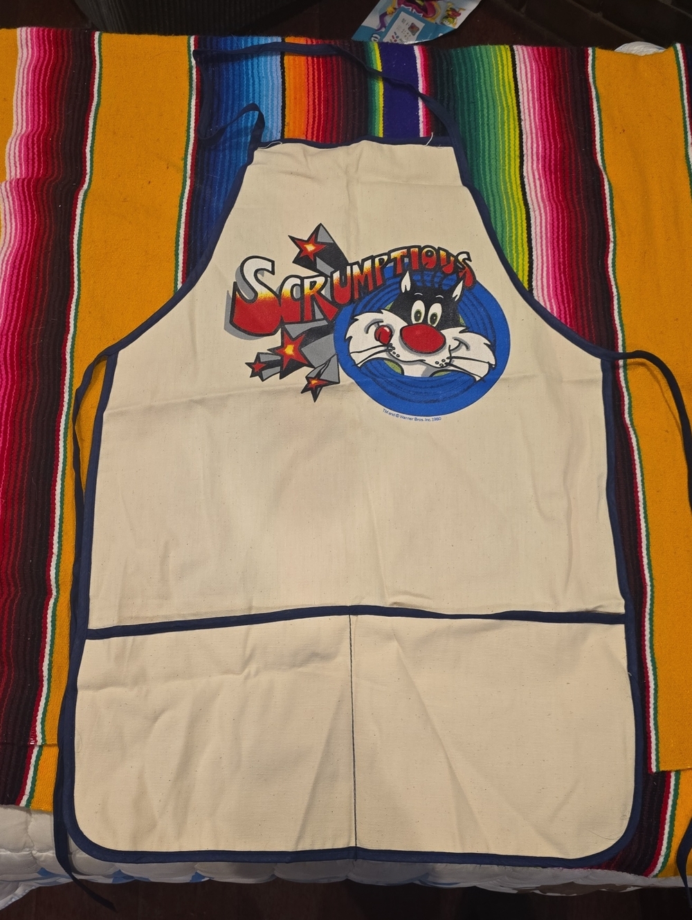 Warner Bros. Cream Apron with Scrumpptious Sylvester Graphic
